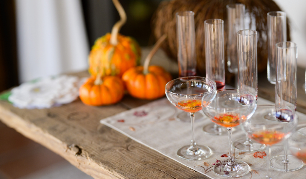 A group of wine glasses on a wooden table, perfect for a birthday party or wedding in the Bay Area.